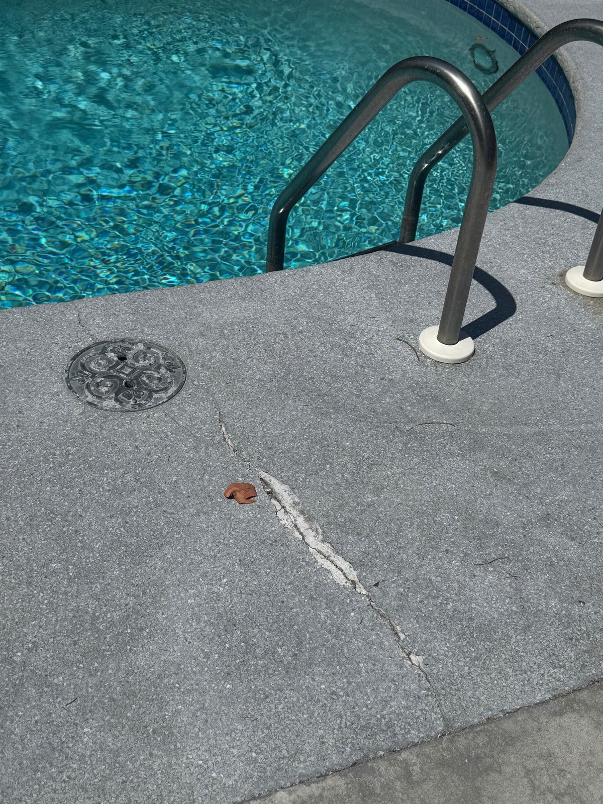 Why Pool Deck Coatings Crack — and What Spanish Marble Does Differently