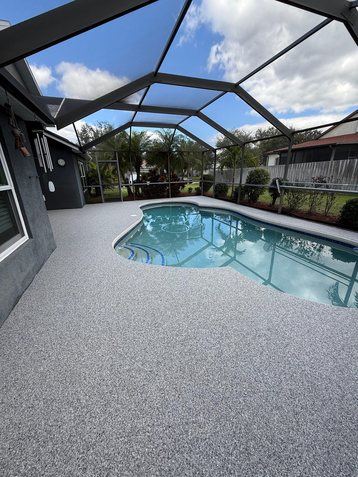 Pool deck completed by CJ Floor Style done with Spanish Marble Resin Bound